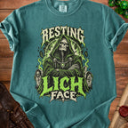 Teal t-shirt with "Resting Lich Face" graphic featuring a skeleton grim reaper.