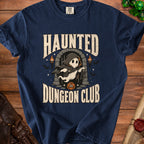 Dark blue t-shirt with "Haunted Dungeon Club" text and a ghost character.