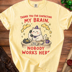 Yellow t-shirt graphic: cat in hat on phone, "Thank You For Contacting My Brain. Nobody Works Here."