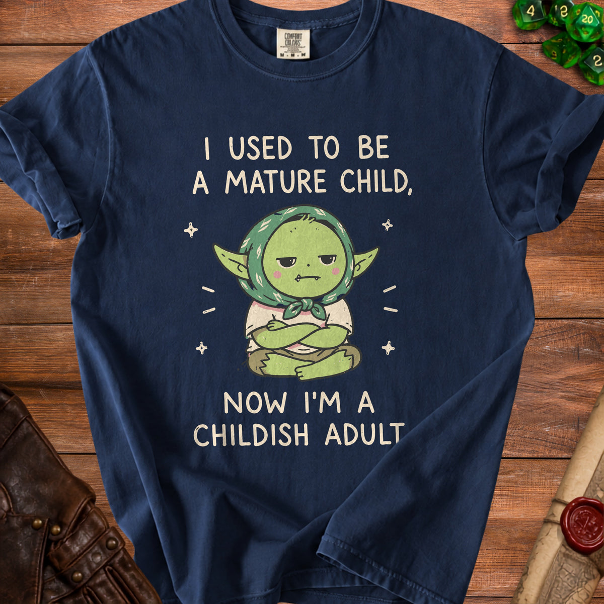 Navy t-shirt with cartoon and text: "I used to be a mature child, now I'm a childish adult."