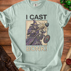 T-shirt graphic of a wizard casting "BONK!" on a skeleton with shield and helmet.