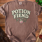 Brown t-shirt with "Potion Fiend" text and a pink potion bottle graphic.