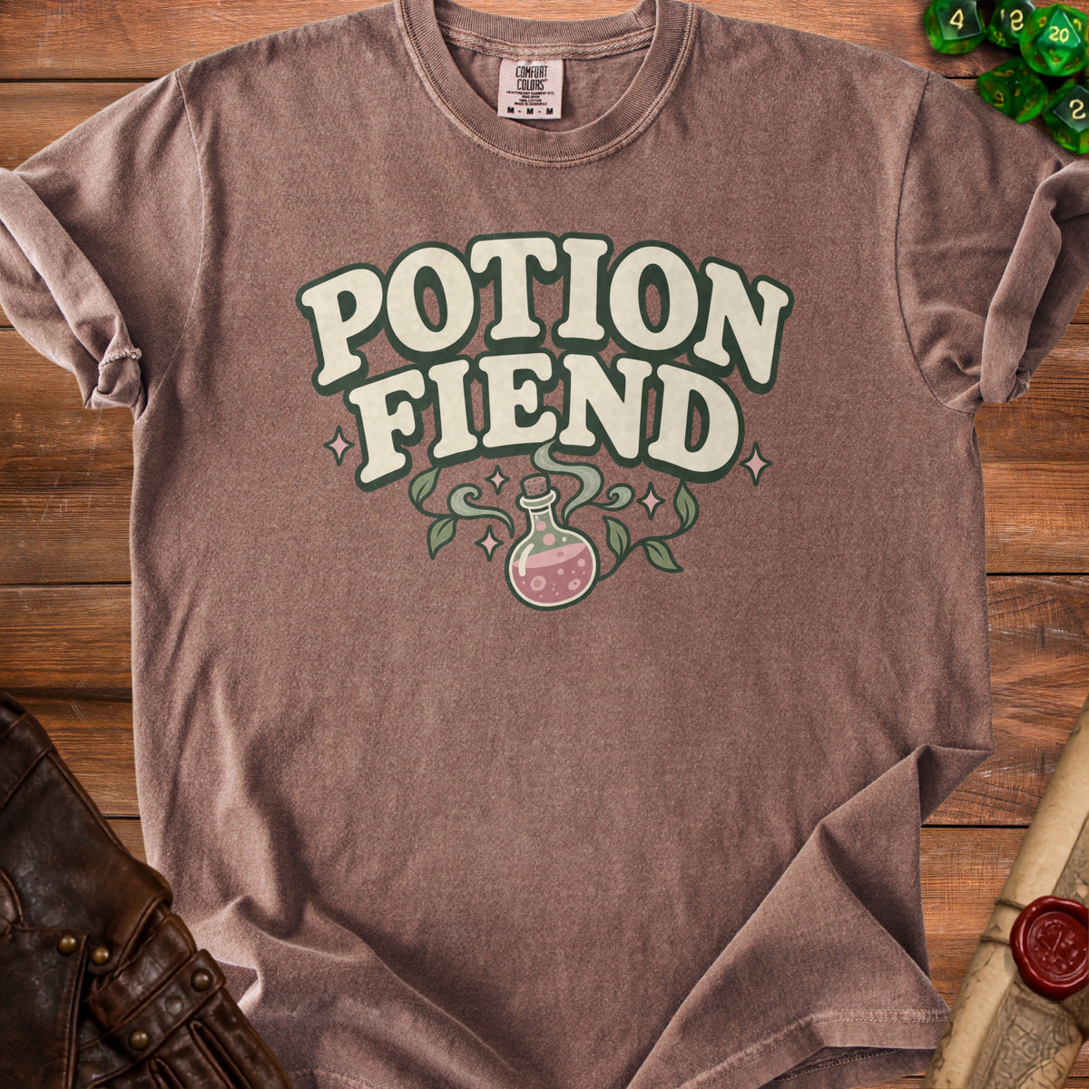 Brown t-shirt with "Potion Fiend" text and a pink potion bottle graphic.