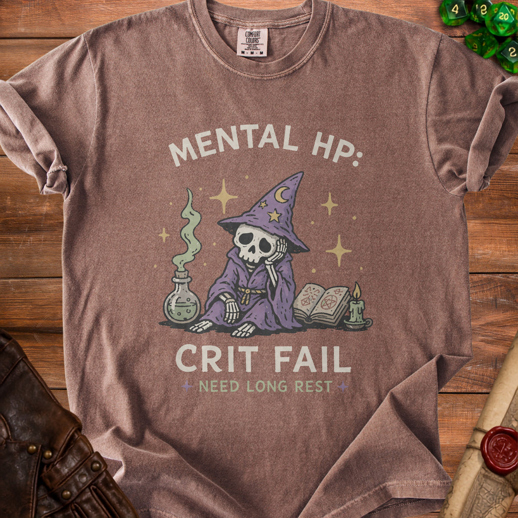 Brown t-shirt with skeleton wizard graphic and text "MENTAL HP: CRIT FAIL NEED LONG REST".