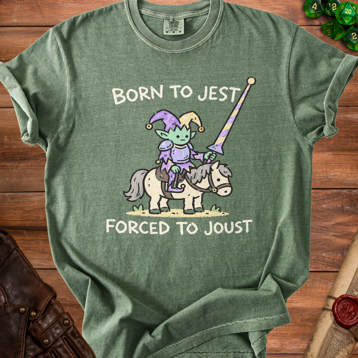 Green t-shirt with "Born to Jest Forced to Joust" text and a jester riding a horse.