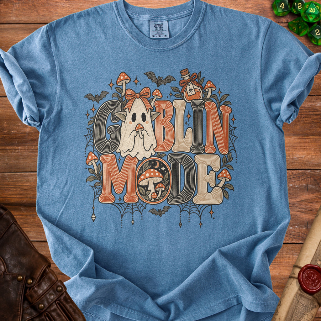 Blue t-shirt with "Goblin Mode" text and ghost, mushrooms, and bats graphic.
