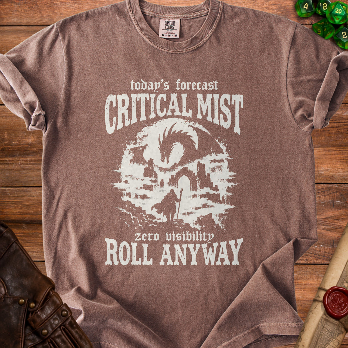 Brown t-shirt with "today's forecast CRITICAL MIST zero visibility ROLL ANYWAY" text.