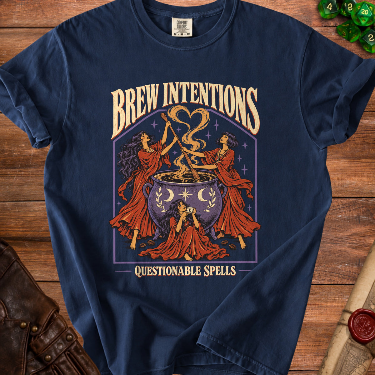 Navy t-shirt with "Brew Intentions Questionable Spells" graphic of witches and a cauldron.