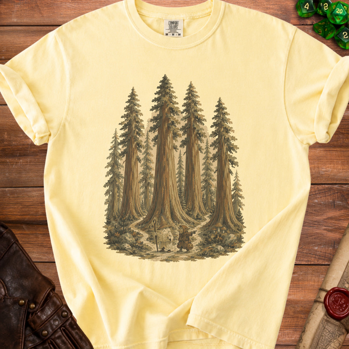 Yellow t-shirt with a forest scene featuring a wizard and a goblin.
