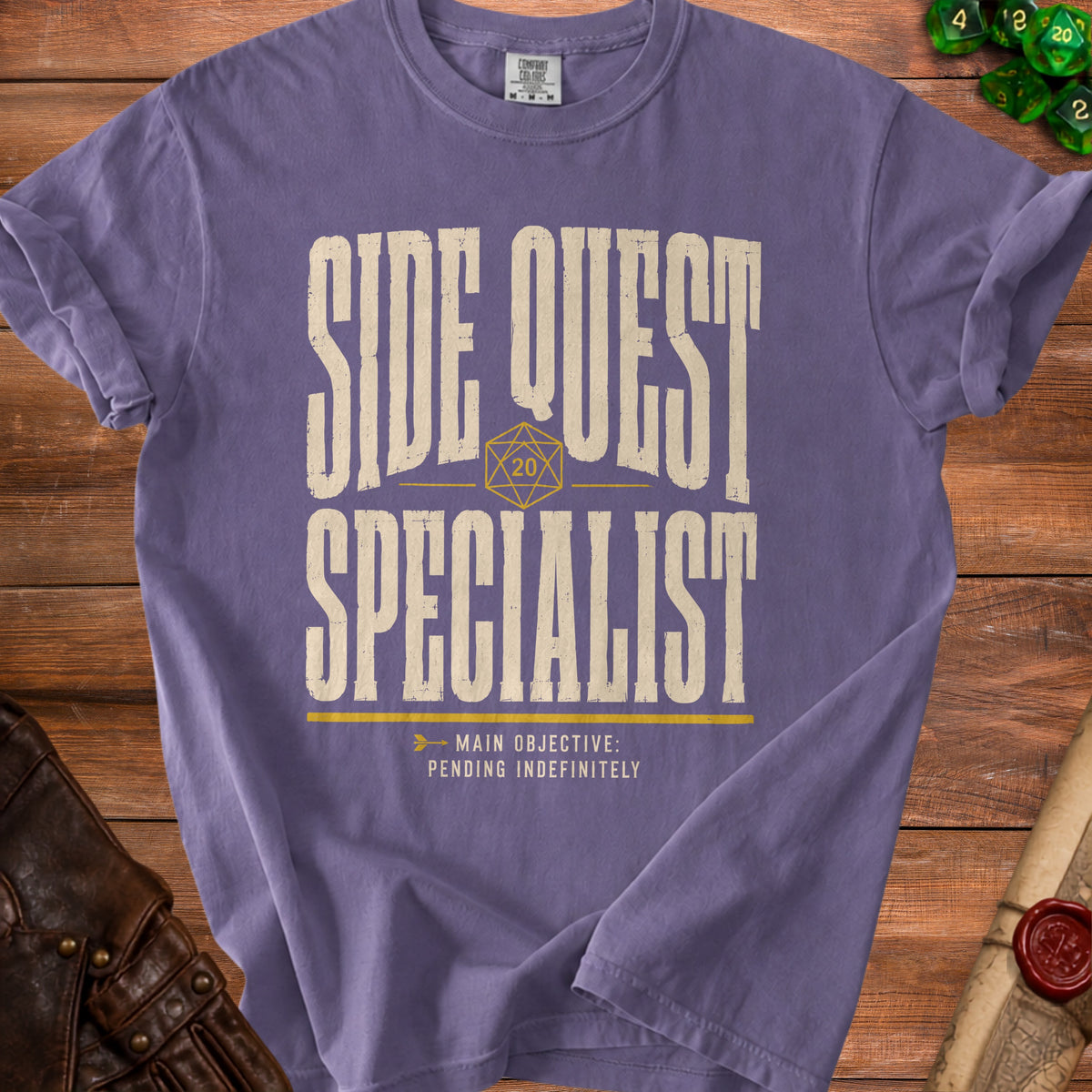 Purple t-shirt with "Side Quest Specialist" and "Main Objective: Pending Indefinitely".