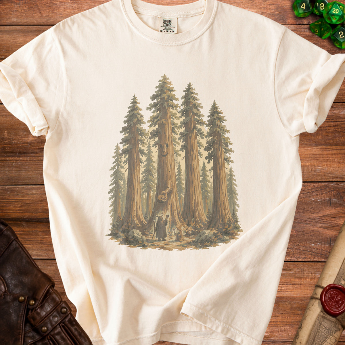Cream t-shirt with forest scene illustration featuring a smiling tree and two figures.