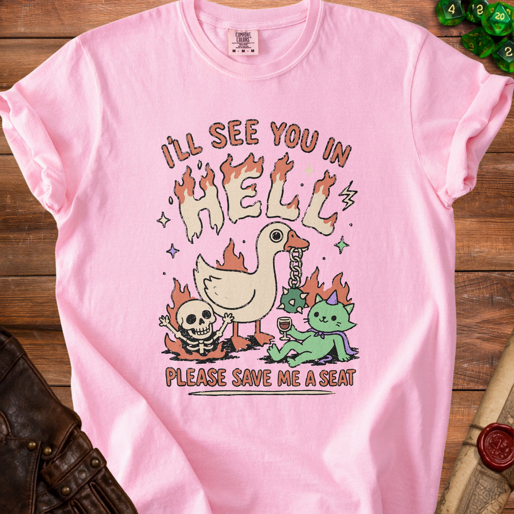 Pink t-shirt with text "I'LL SEE YOU IN HELL PLEASE SAVE ME A SEAT".