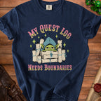 Navy t-shirt with a cartoon goblin and scrolls reading "My Quest Log Needs Boundaries."