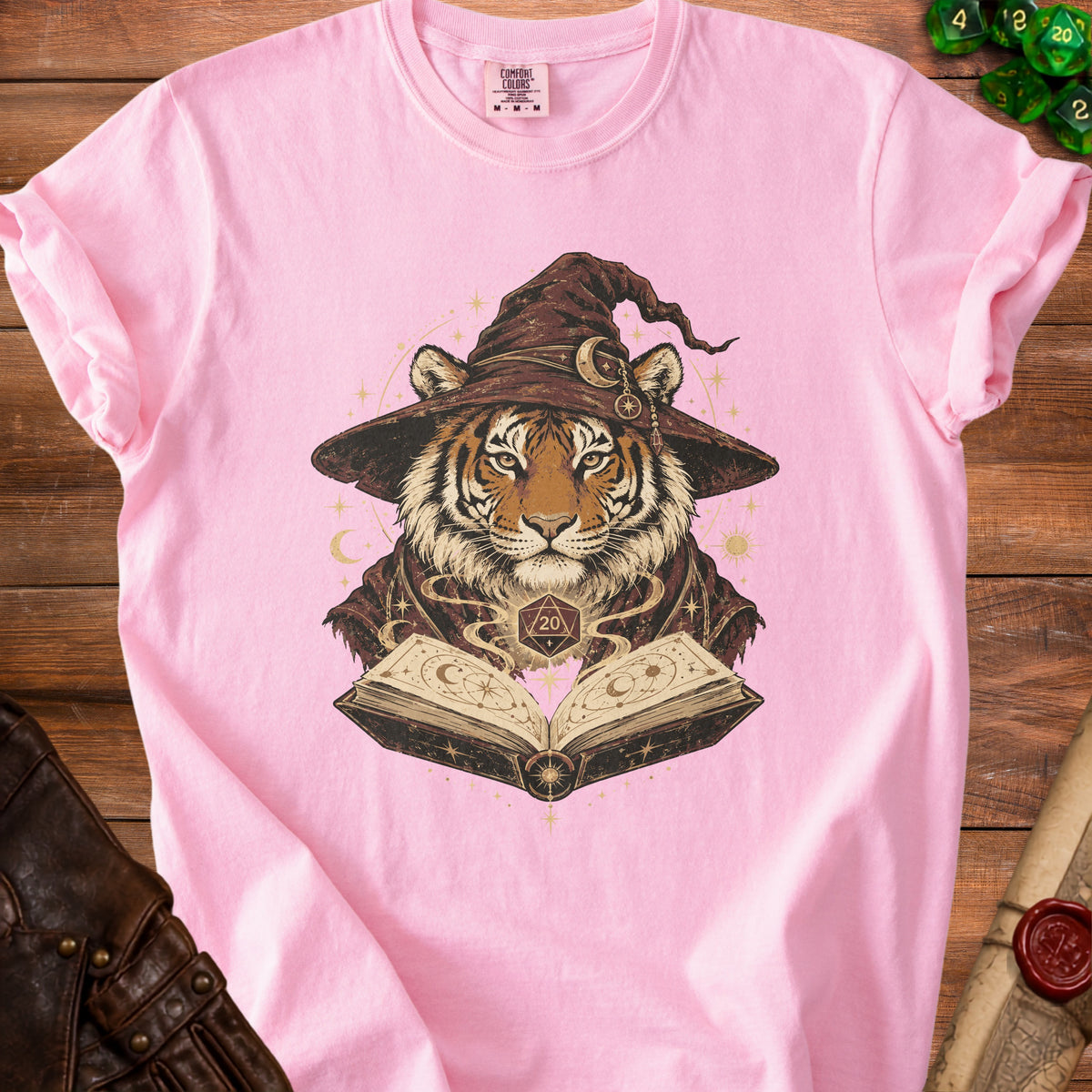 Pink t-shirt with tiger wizard design, open book, and d20 dice.