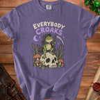 Purple t-shirt with "Everybody Croaks" text and Grim Reaper frog on a skull.