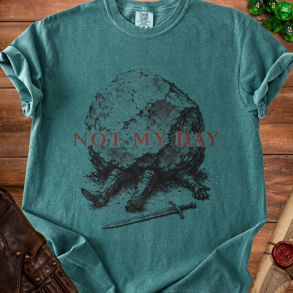 Teal t-shirt with a knight trapped under a rock, text "NOT MY DAY".