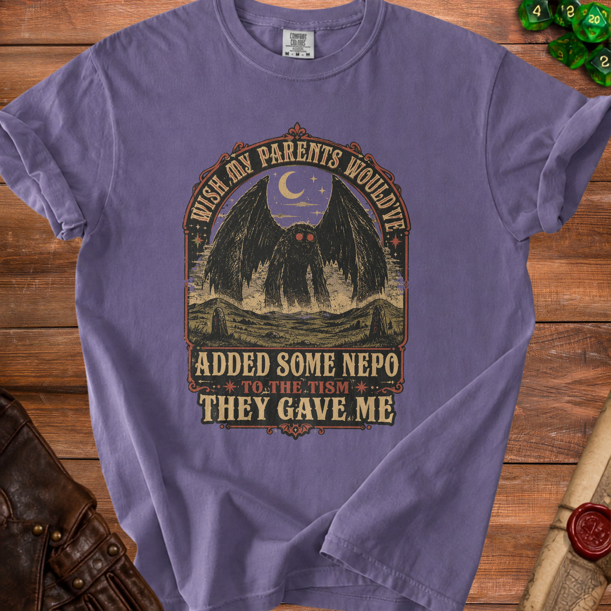 Purple t-shirt with Mothman graphic and text "Wish my parents would've added some nepo to the tism they gave me."
