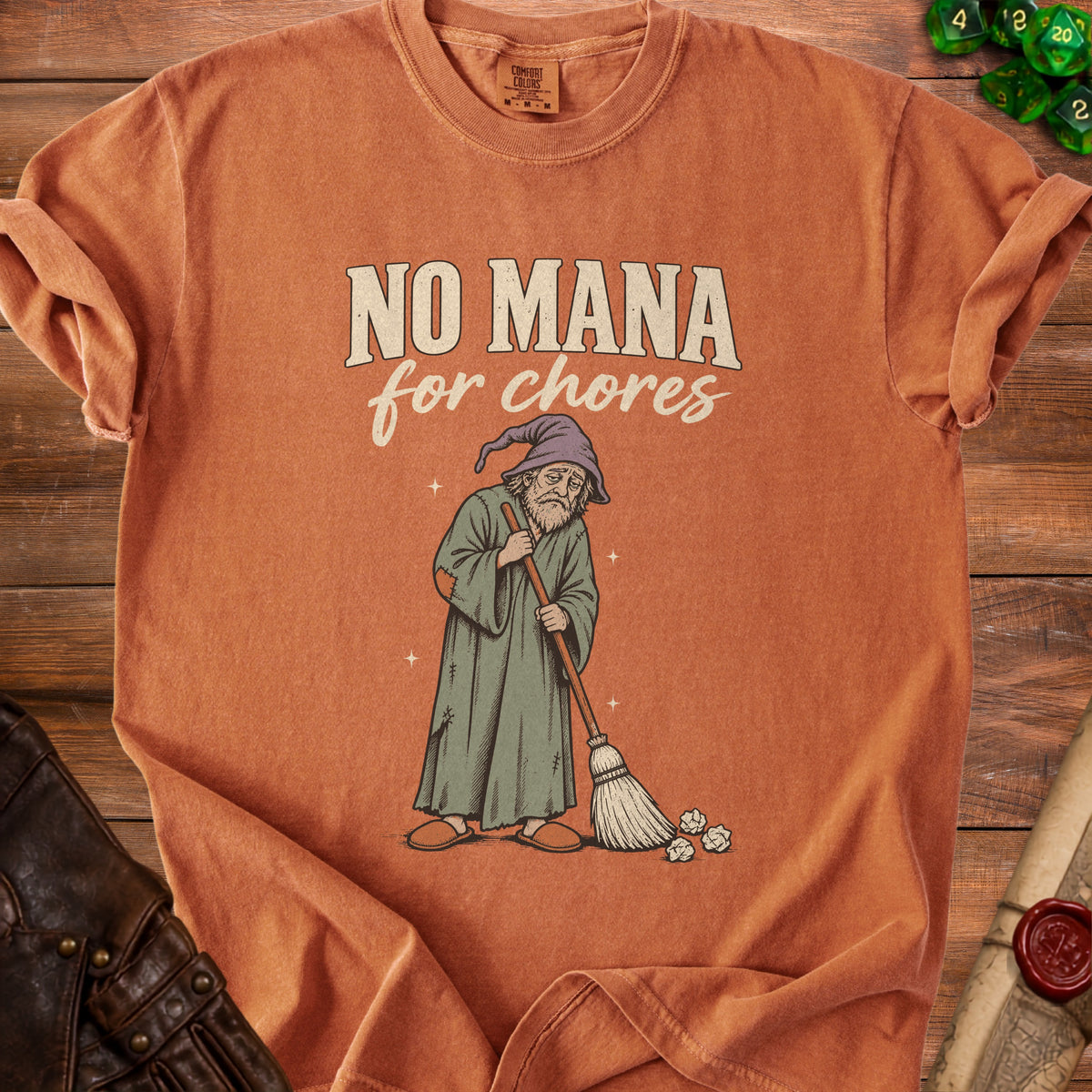 Orange t-shirt with "NO MANA for chores" text and wizard sweeping.