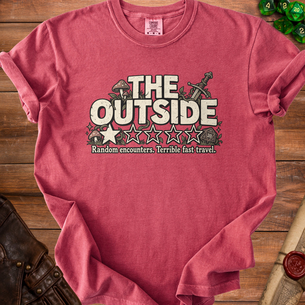 Red t-shirt with "THE OUTSIDE" text, stars, dice, sword, and mushrooms.