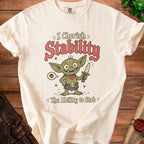 Cream t-shirt with a goblin graphic and text "I Cherish Stability The Ability to Stab".