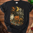 Black t-shirt with a Halloween graphic of a black cat, skeleton, pumpkin, and moon.