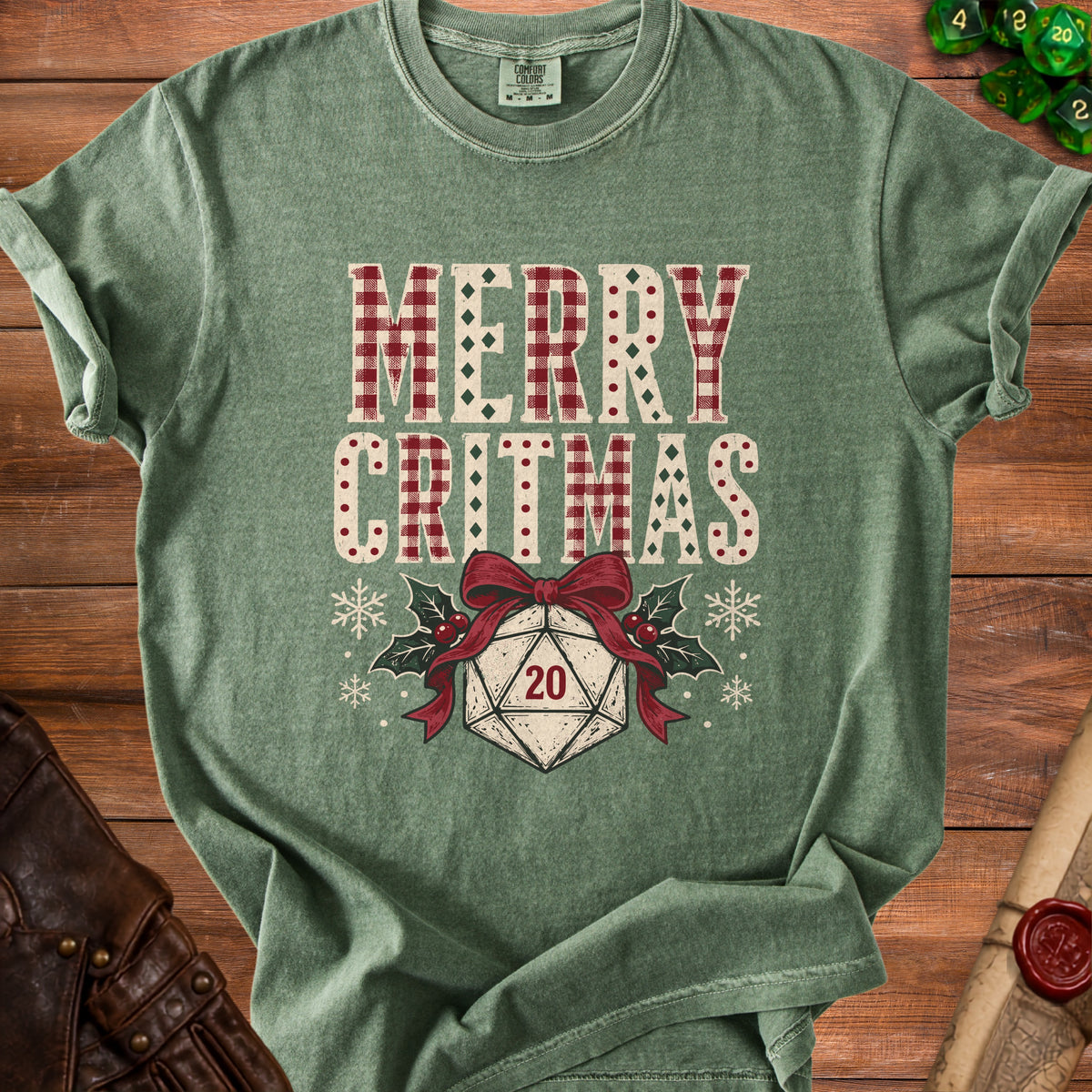 Green t-shirt with "Merry Critmas" text and a D20 die.