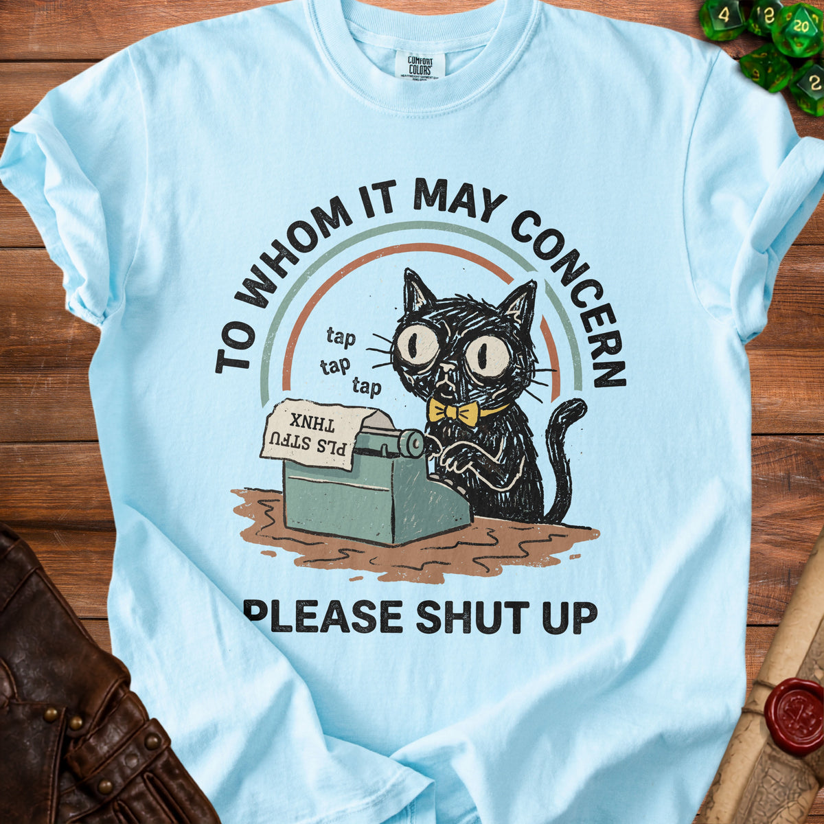 Light blue t-shirt with a black cat typing and the text "TO WHOM IT MAY CONCERN PLEASE SHUT UP".