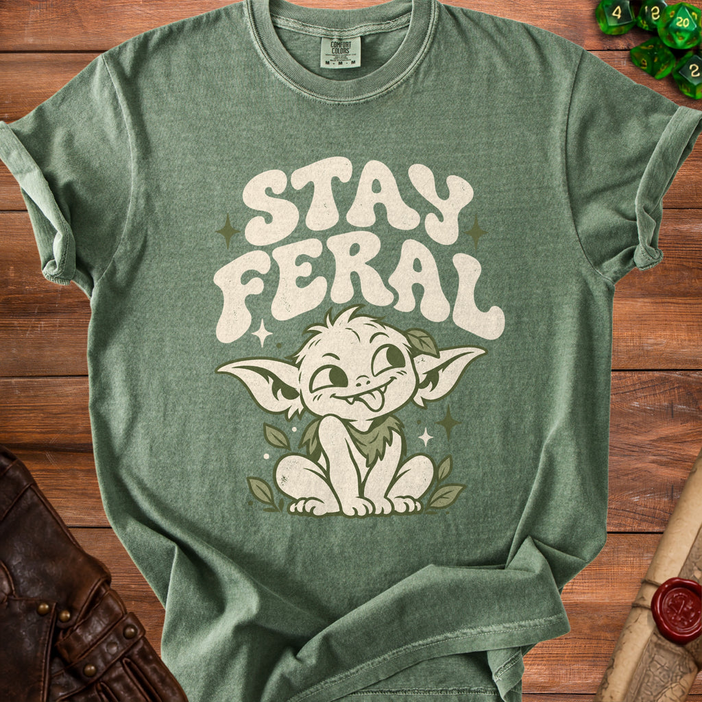 Green t-shirt with "STAY FERAL" text and a mischievous creature graphic.