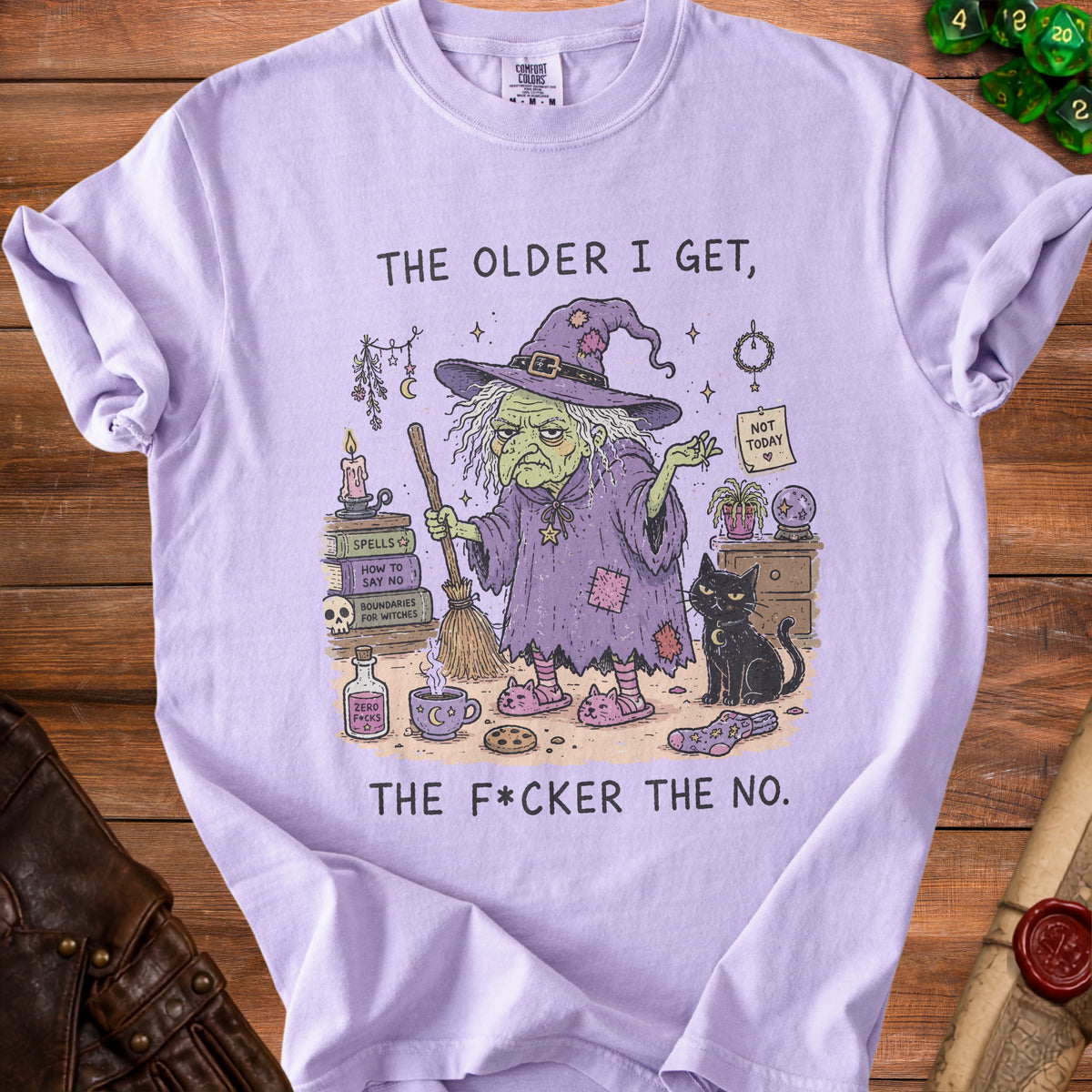 Purple t-shirt with a witch, black cat, and spell books, reading "The older I get, the f*cker the no."