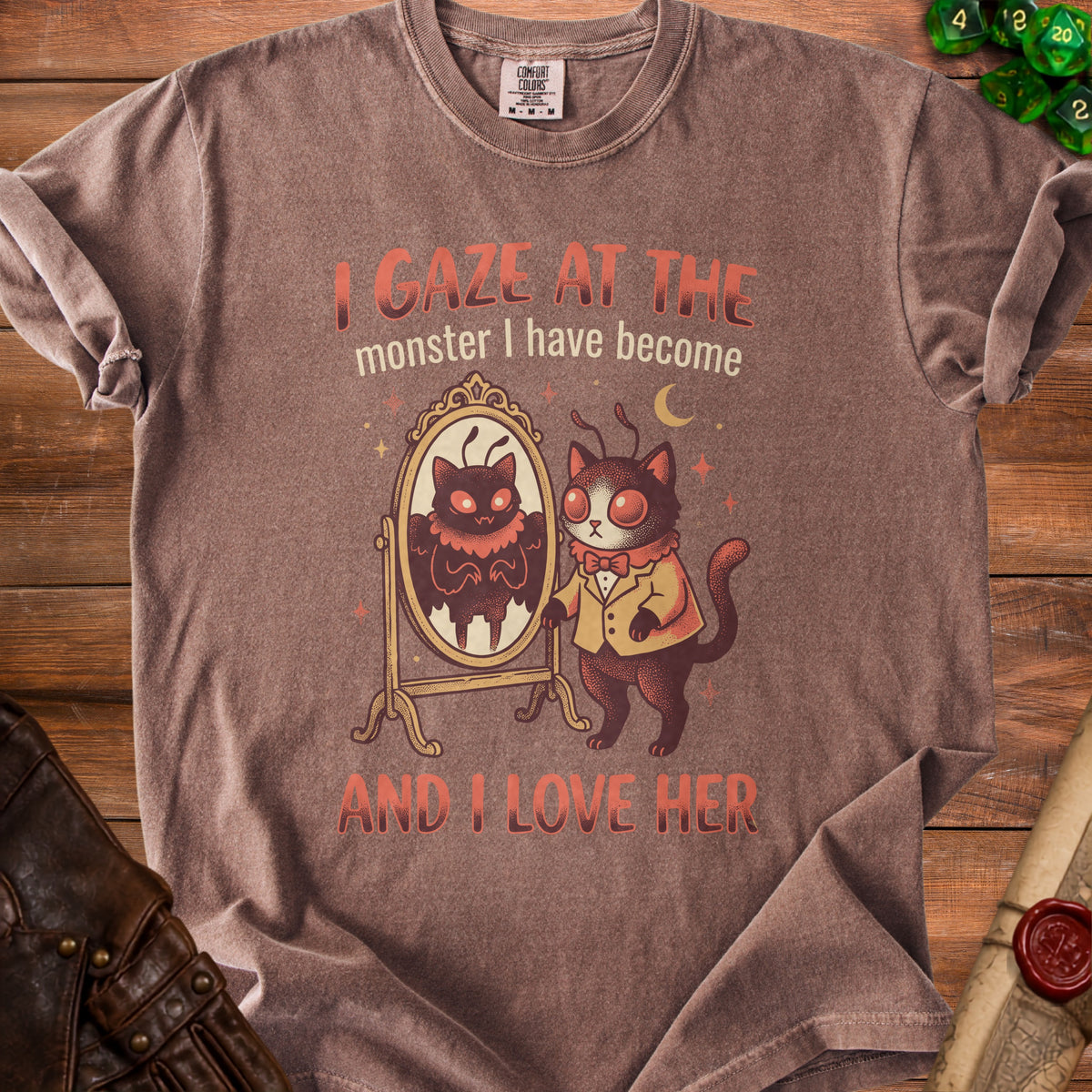 Brown t-shirt with a cat looking in a mirror reflecting a moth, with text.