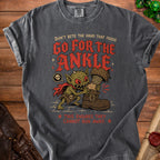 T-shirt graphic of a goblin biting a boot with text "Go for the Ankle".