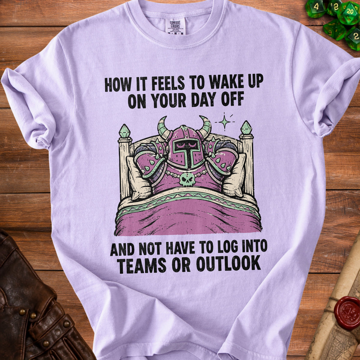Light purple t-shirt with knights in bed graphic and text "How it feels to wake up on your day off".