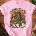 Pink t-shirt with "Dungeon Loot Goblin" graphic featuring a goblin, dice, and treasure.