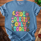 Blue t-shirt with "Side Quests Only Today" in colorful, rounded letters.