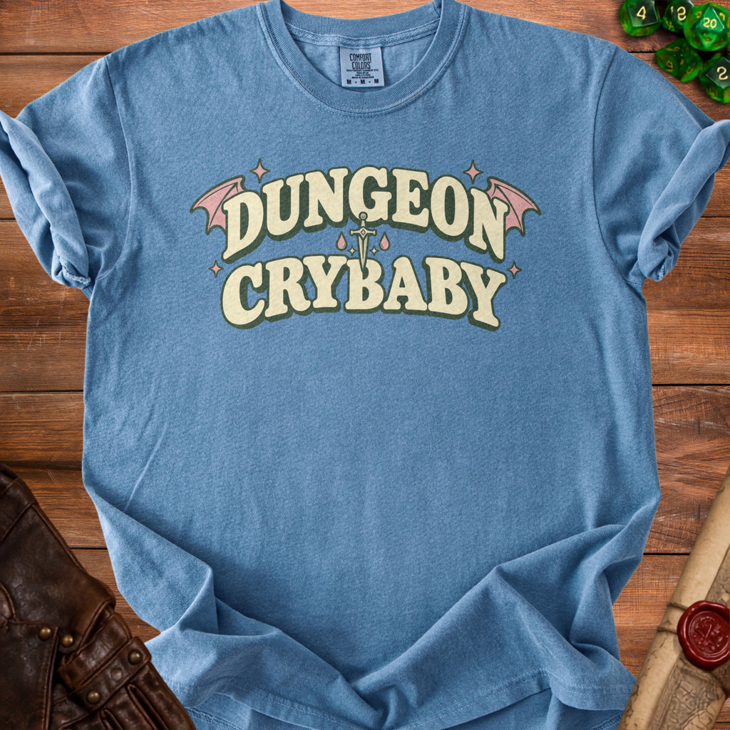 Blue t-shirt with "Dungeon Crybaby" text and dagger design.