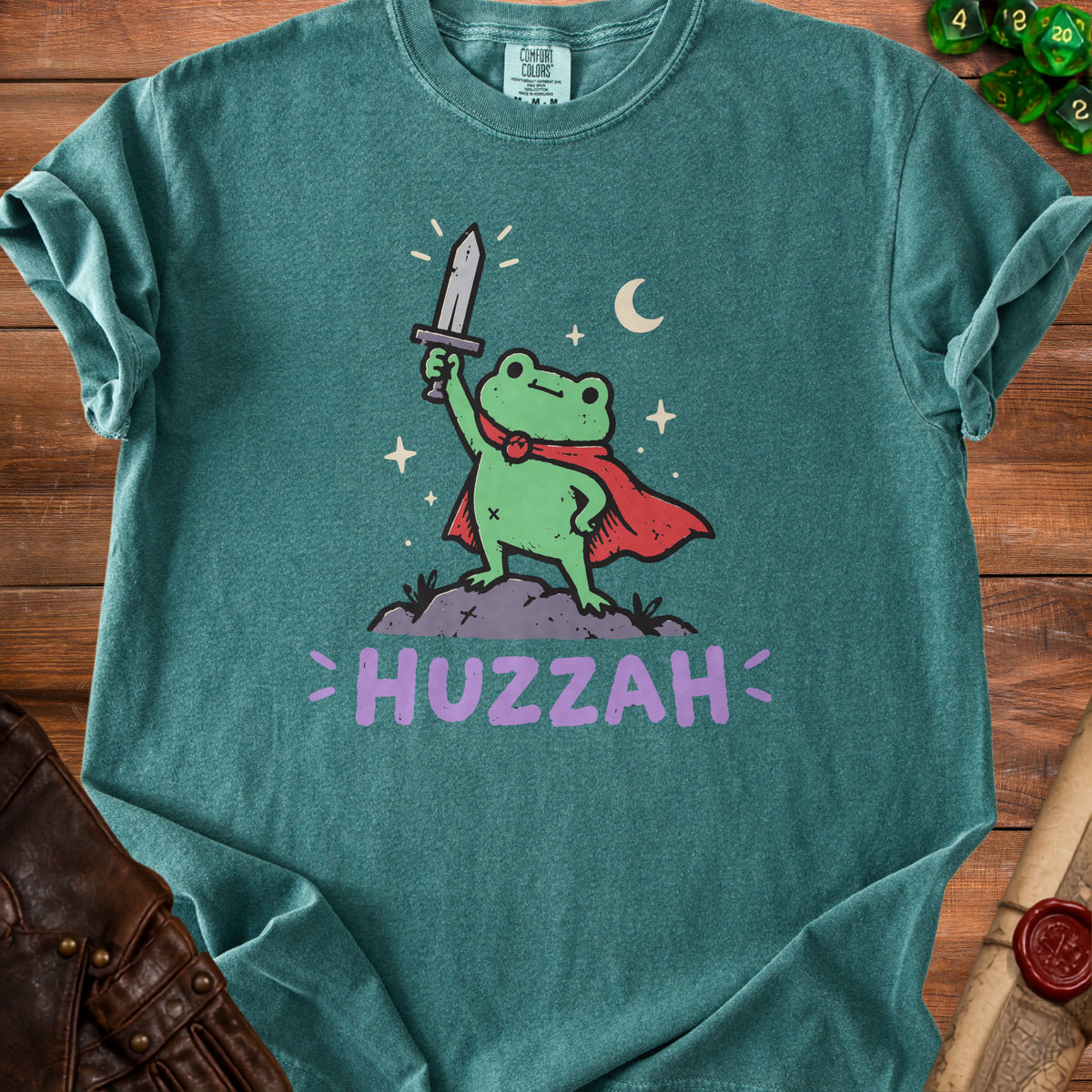 Frog wearing a cape and holding a sword with "HUZZAH" text below.