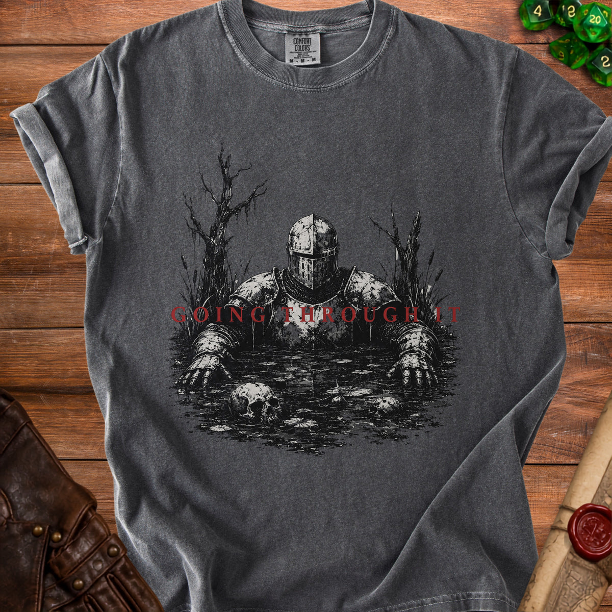 Dark t-shirt with knight in swamp graphic and red text "GOING THROUGH IT".