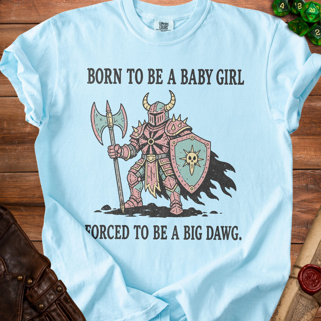 Light blue t-shirt with knight graphic and text "BORN TO BE A BABY GIRL FORCED TO BE A BIG DAWG."