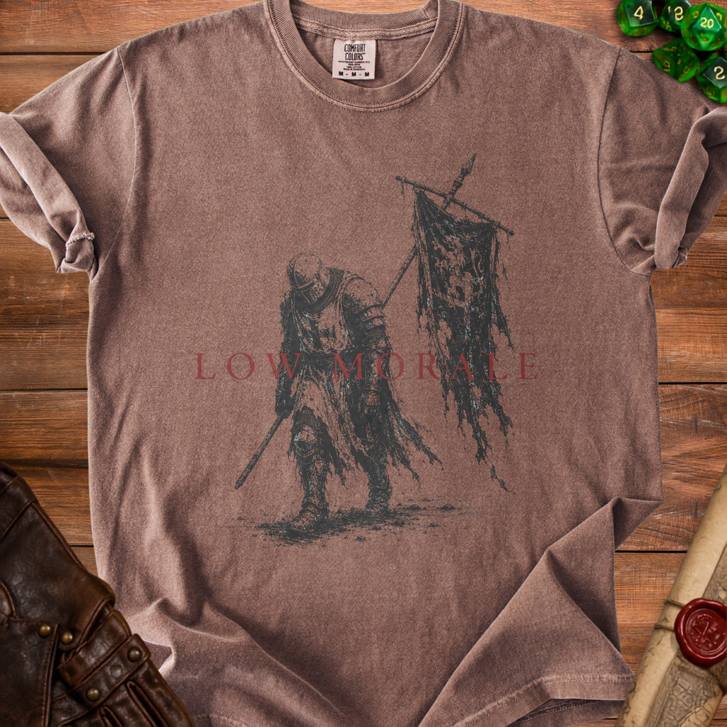 Brown t-shirt with medieval knight graphic and "LOW MORALE" text.