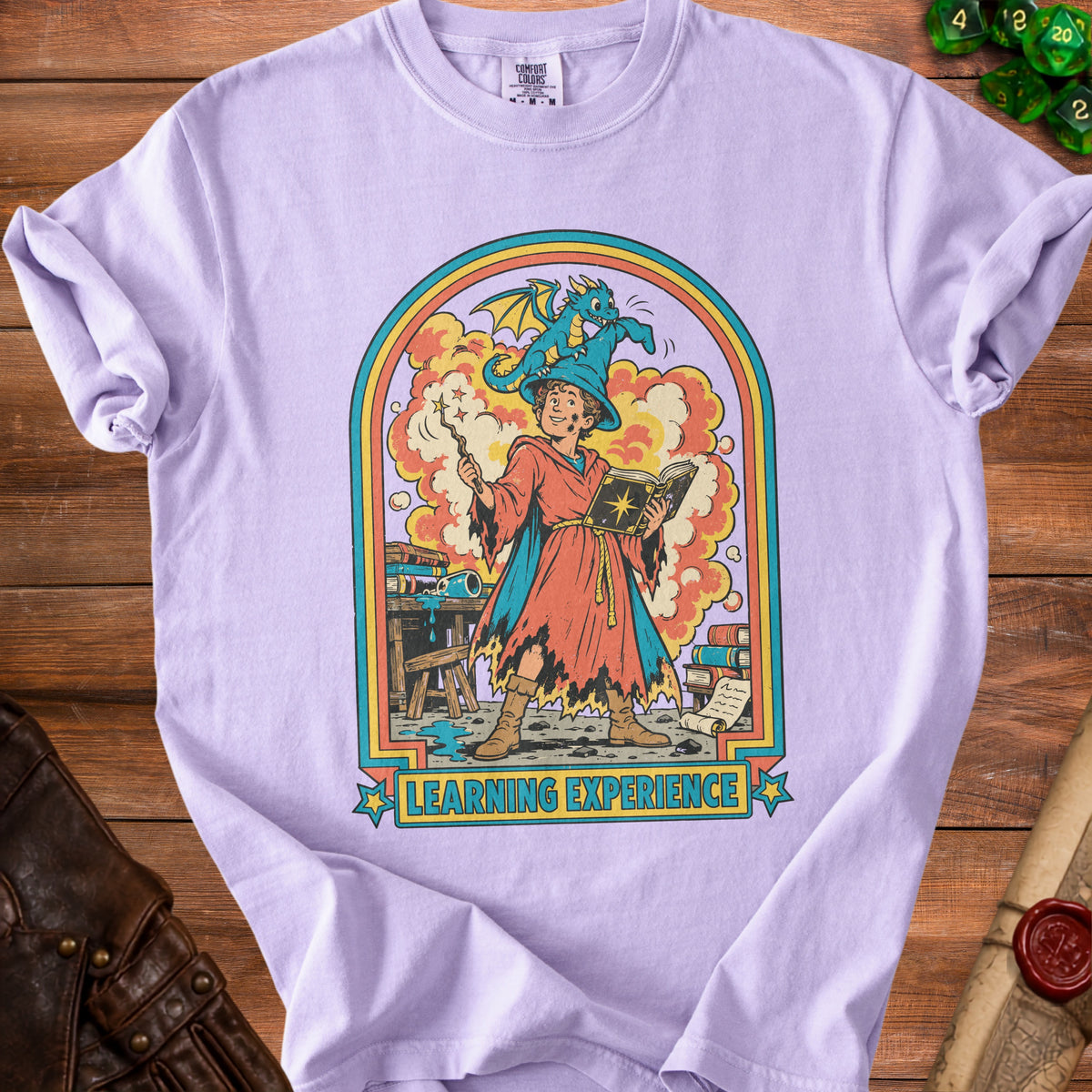 Young wizard with a dragon on his hat, holding a book and wand, text "LEARNING EXPERIENCE".