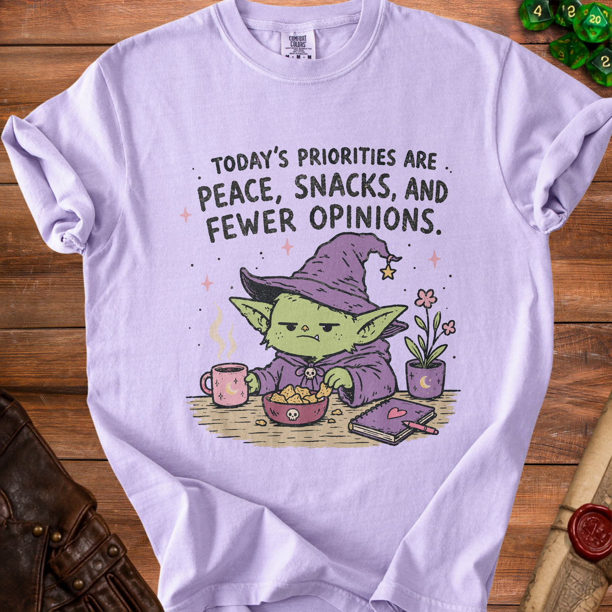 Goblin wearing witch hat with text: "Today's priorities are peace, snacks, and fewer opinions."