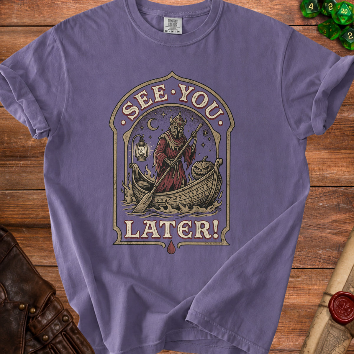 T-shirt with a graphic of a skeleton in a boat, a pumpkin, and text reading "SEE YOU LATER!".