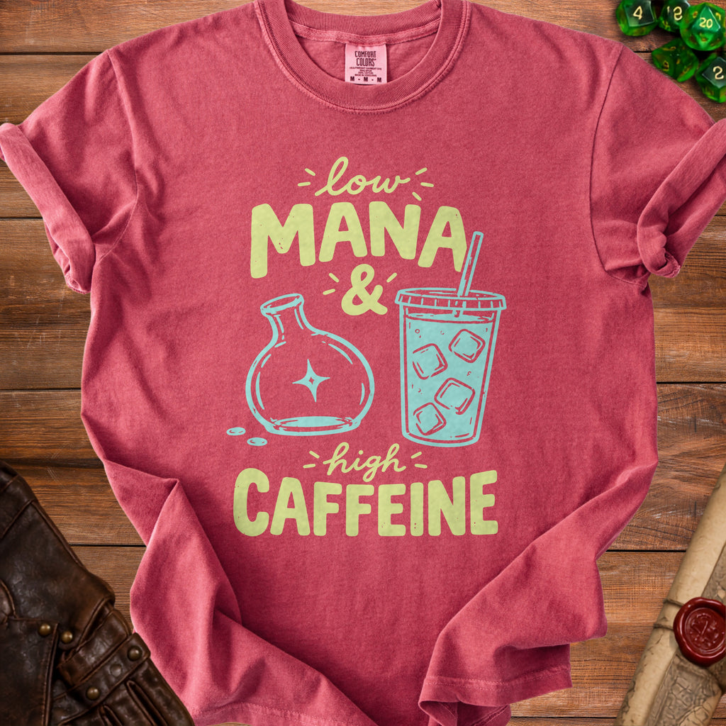 Red t-shirt with "low MANA & high CAFFEINE" graphic featuring potion and coffee.