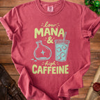 Red t-shirt with "low MANA & high CAFFEINE" graphic featuring potion and coffee.