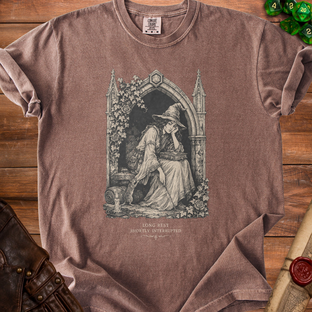 Brown t-shirt with gothic arch design of a witch reading, text "LONG REST SHORTLY INTERRUPTED".