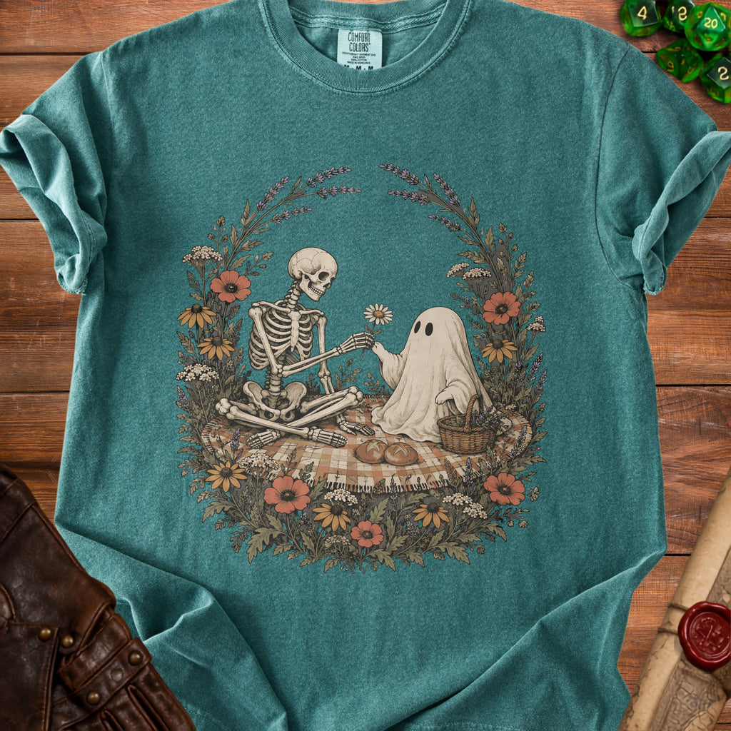 Skeleton offering a flower to a ghost on a picnic blanket surrounded by flowers.