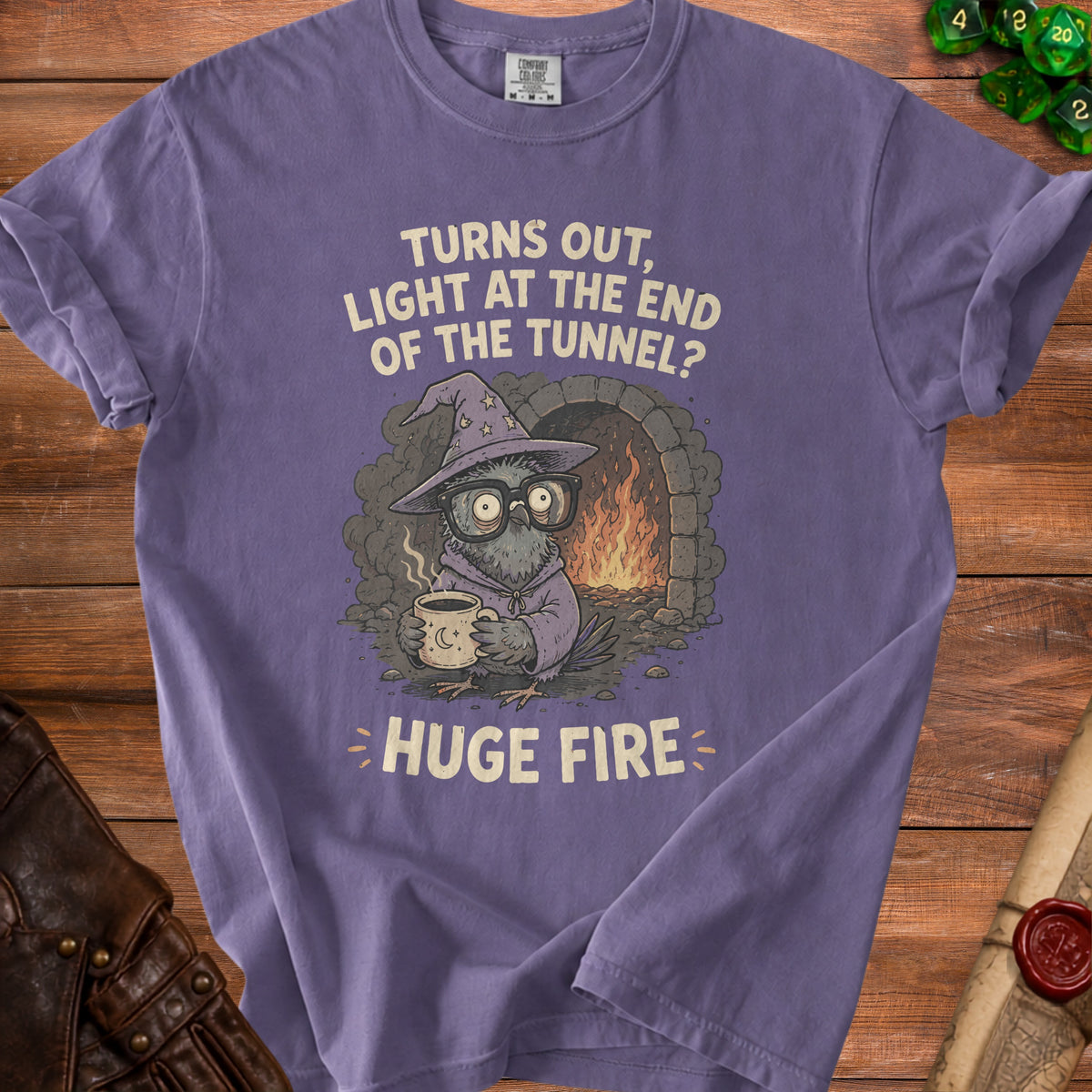 Purple t-shirt graphic with owl wizard and text "Turns out, light at the end of the tunnel? HUGE FIRE".