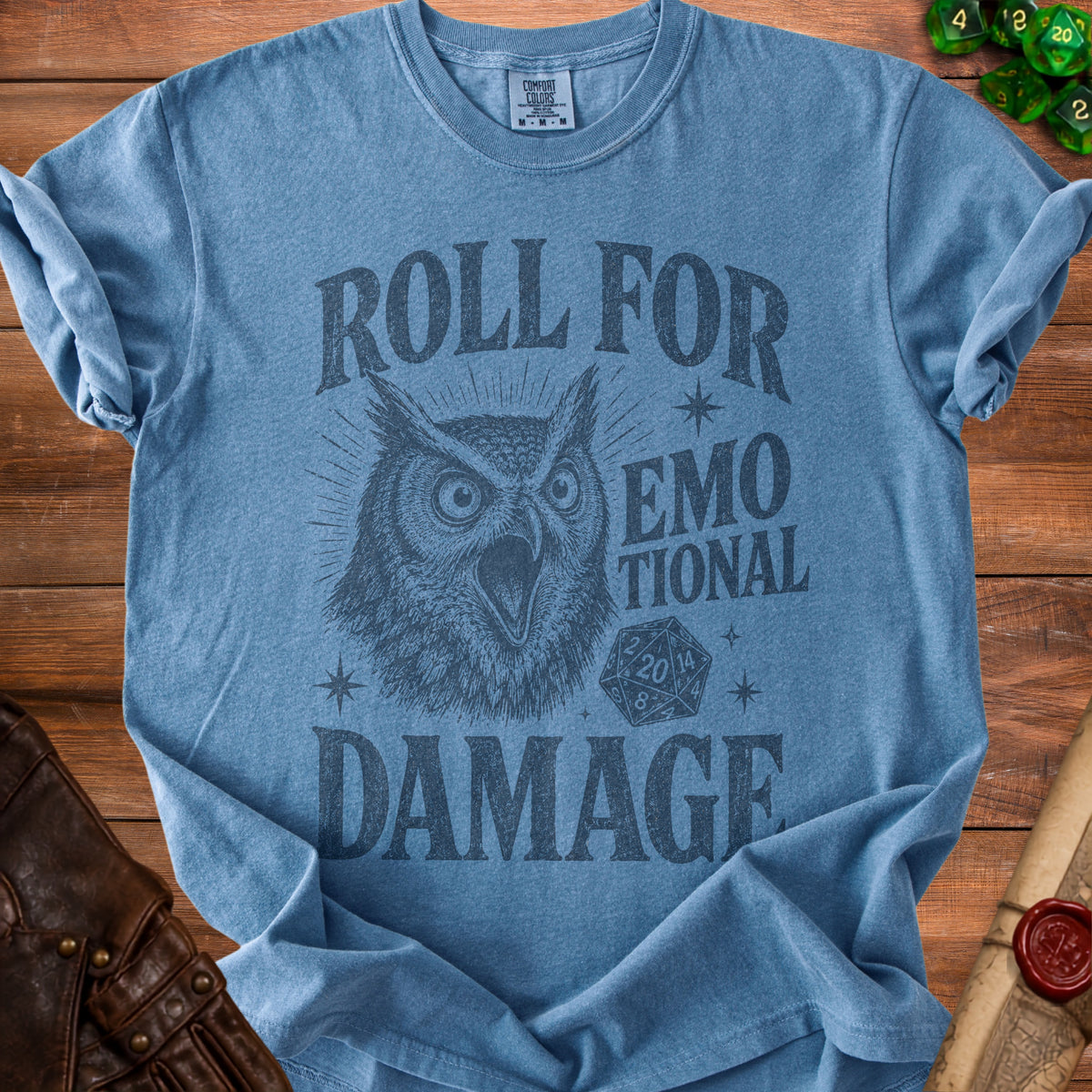 Blue t-shirt with dark gray owl graphic and text "Roll for emotional damage".