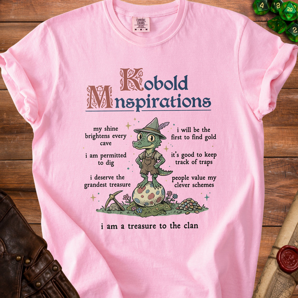 Pink t-shirt with "Kobold Minspirations" graphic and illustration of a dragon.