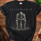 Black t-shirt with "overwhelmed" text above a seated knight holding a sword.